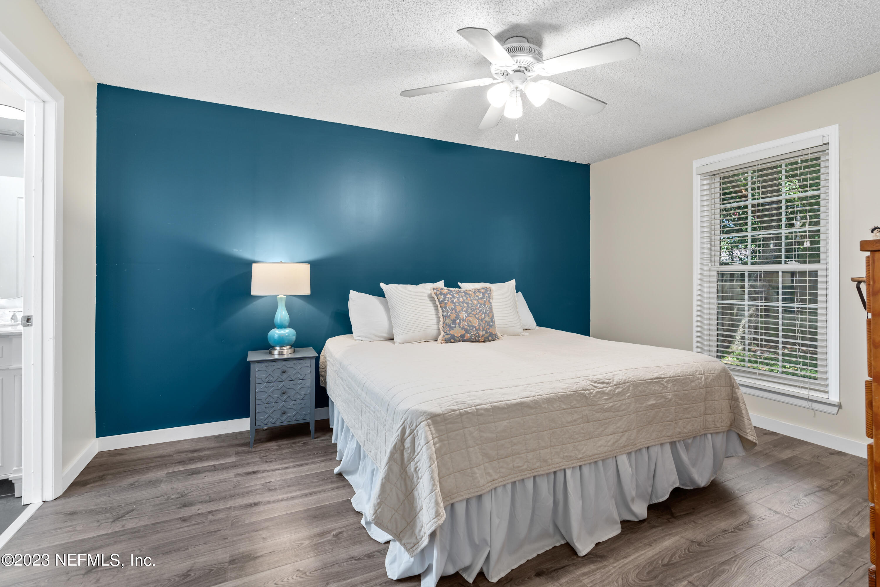 107 Heron Road St. Augustine, FL 32086 - Photo 5 of 39 a bedroom with a bed and a large window