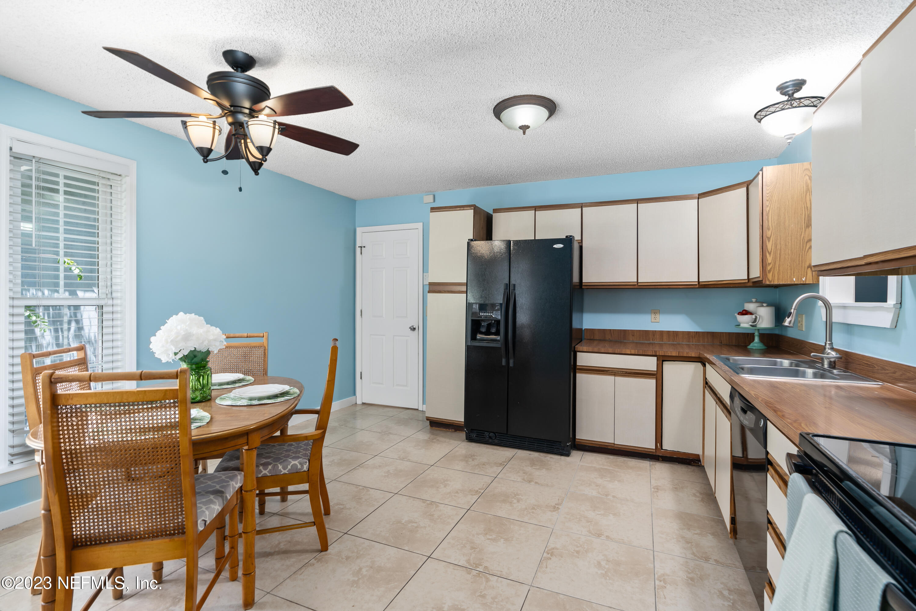 107 Heron Road St. Augustine, FL 32086 - Photo 9 of 39 a kitchen with stainless steel appliances granite countertop a dining table chairs stove and refrigerator