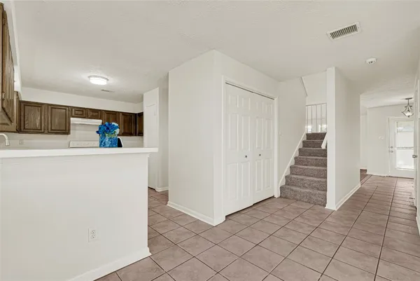a kitchen with sink and cabinets