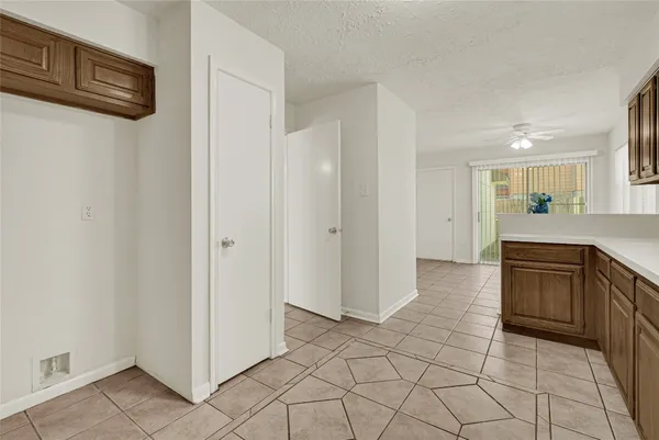 a large bathroom with a granite countertop sink a mirror and a shower