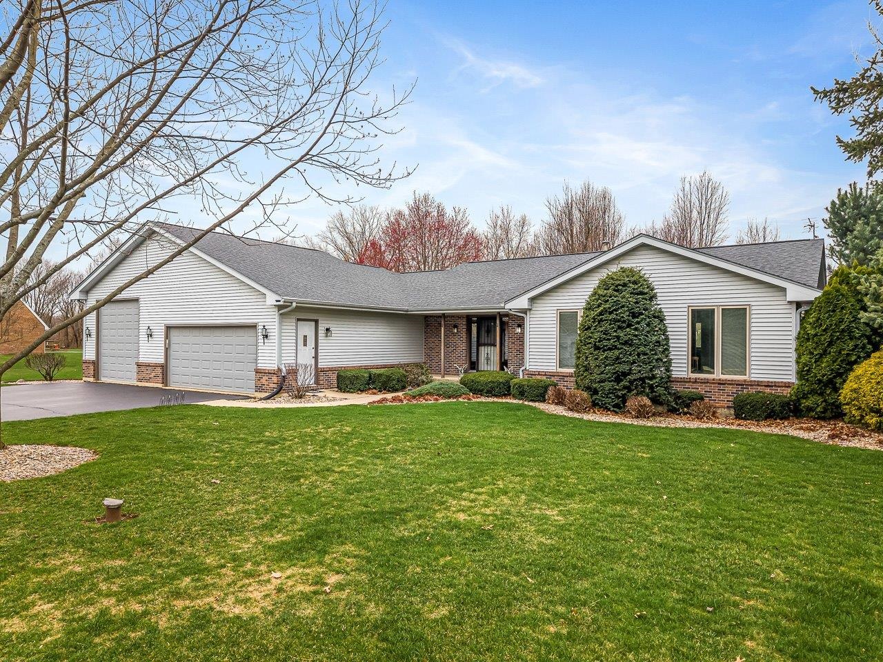 9744 Prairie Lane Belvidere, IL 61008 - Photo 1 of 66 a view of a house with a yard and sitting area