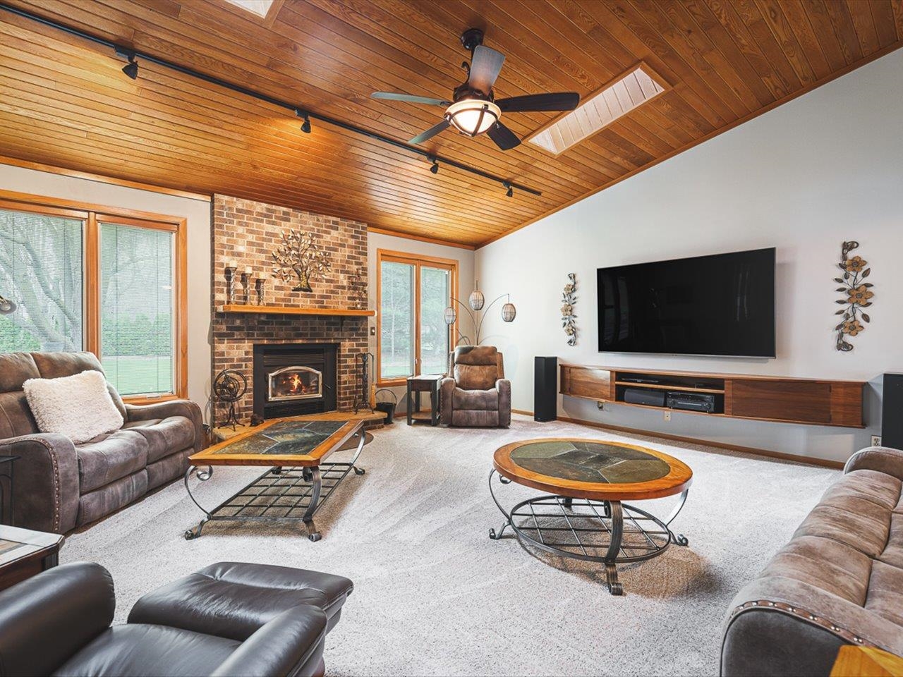 9744 Prairie Lane Belvidere, IL 61008 - Photo 11 of 66 a living room with furniture a flat screen tv and a large window