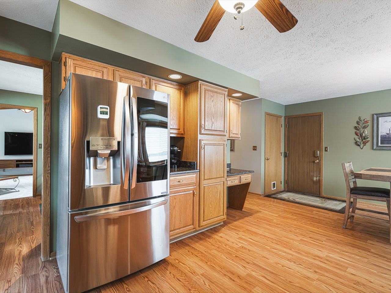9744 Prairie Lane Belvidere, IL 61008 - Photo 18 of 66 a kitchen with stainless steel appliances granite countertop a refrigerator and a sink