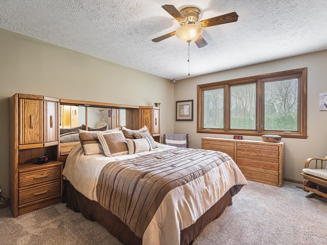 9744 Prairie Lane Belvidere, IL 61008 - Photo 23 of 66 a bedroom with a bed and a large window with the outer view