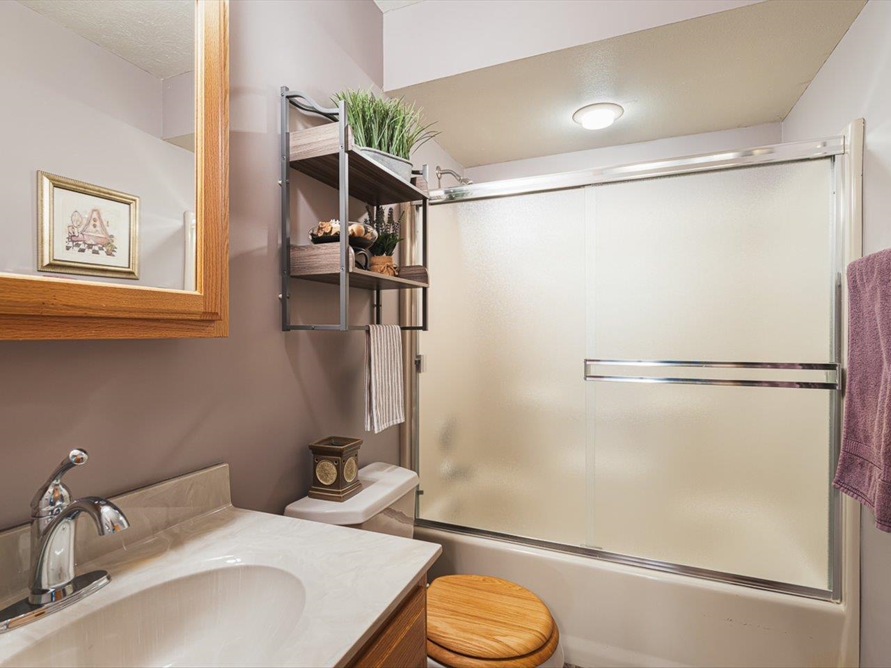 9744 Prairie Lane Belvidere, IL 61008 - Photo 30 of 66 a bathroom with a sink toilet and shower