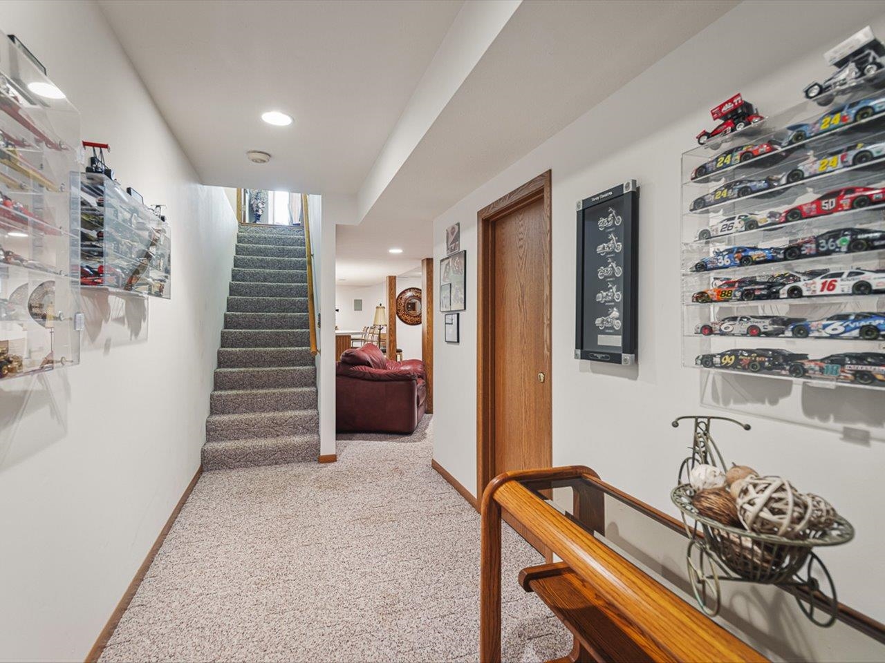 9744 Prairie Lane Belvidere, IL 61008 - Photo 37 of 66 a room with furniture a rug and paintings on the wall