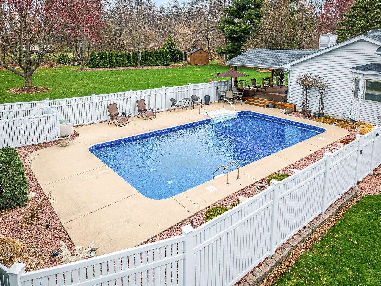 9744 Prairie Lane Belvidere, IL 61008 - Photo 56 of 66 a view of a patio with a table and chairs under an umbrella