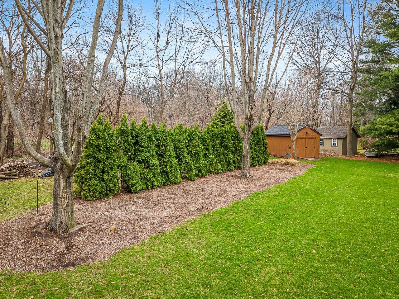 9744 Prairie Lane Belvidere, IL 61008 - Photo 59 of 66 a view of a backyard with large trees