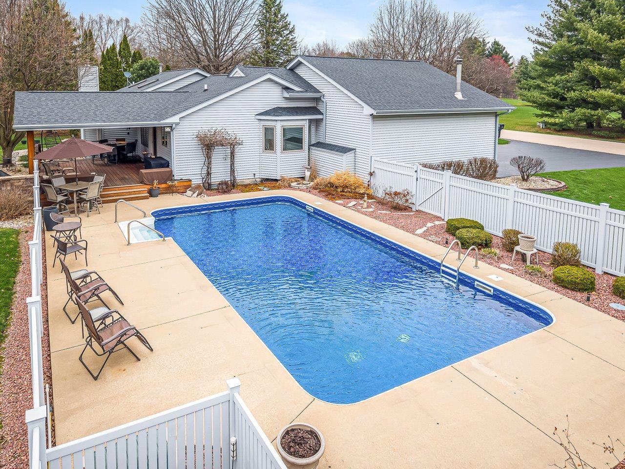9744 Prairie Lane Belvidere, IL 61008 - Photo 62 of 66 a view of a house with pool and chairs
