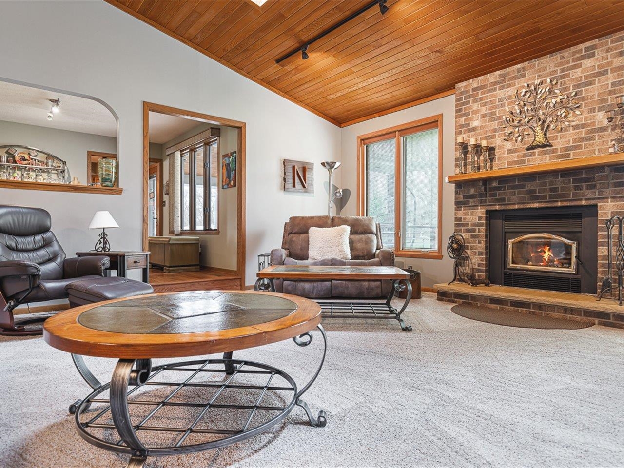 9744 Prairie Lane Belvidere, IL 61008 - Photo 10 of 66 a living room with furniture a fireplace and a table