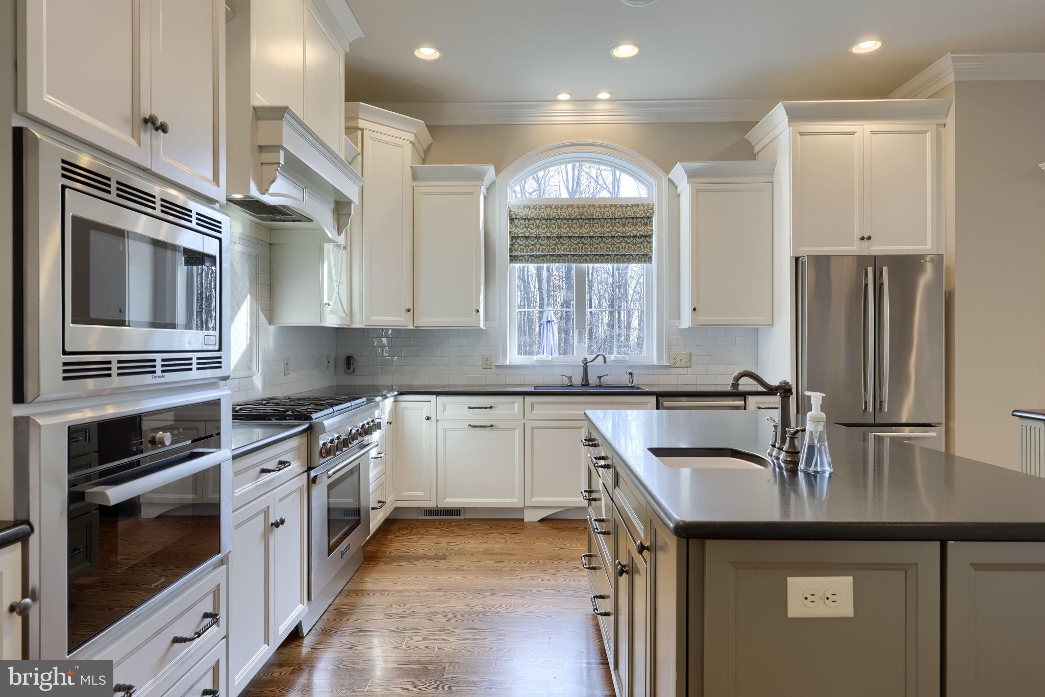 521 Meetinghouse Road Gap, PA 17527 - Photo 11 of 79 a kitchen with kitchen island granite countertop a sink cabinets and stainless steel appliances