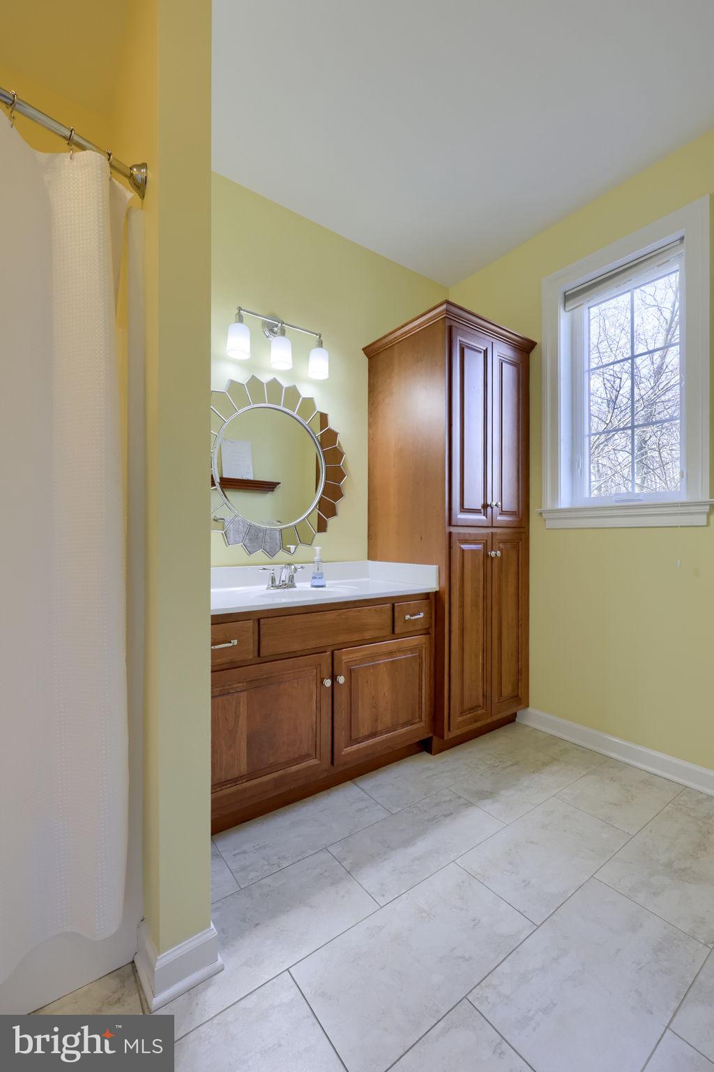 521 Meetinghouse Road Gap, PA 17527 - Photo 47 of 79 a spacious bathroom with a granite countertop sink and a mirror