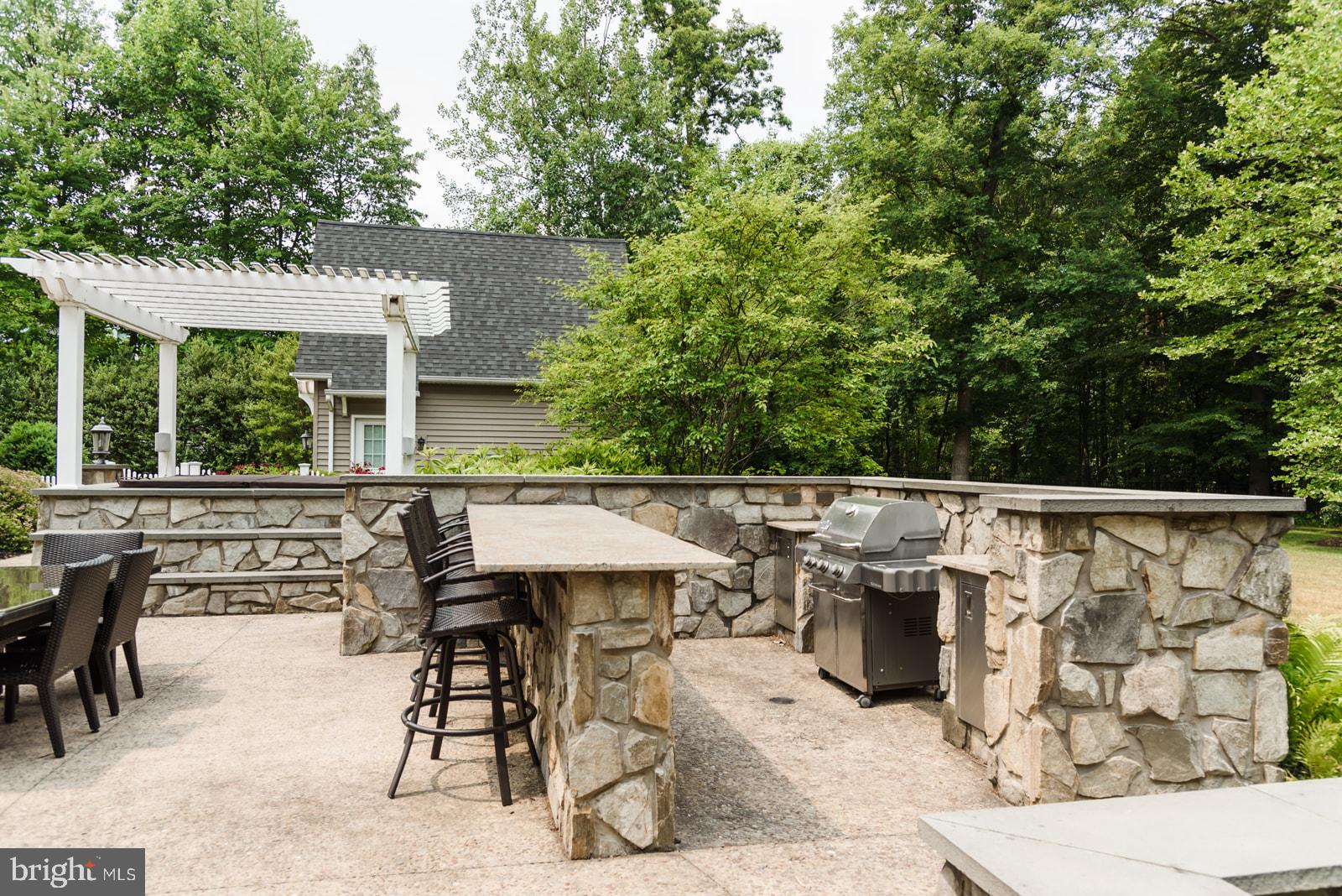 521 Meetinghouse Road Gap, PA 17527 - Photo 72 of 81 Inviting outdoor kitchen with stone accents.