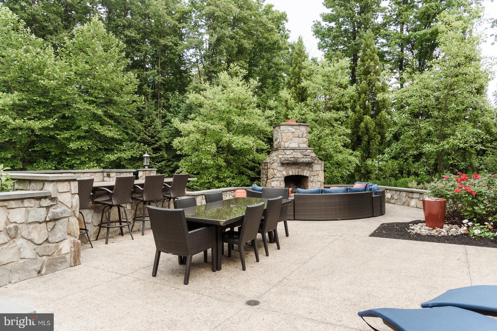 521 Meetinghouse Road Gap, PA 17527 - Photo 73 of 81 Serene outdoor retreat with stone fireplace.