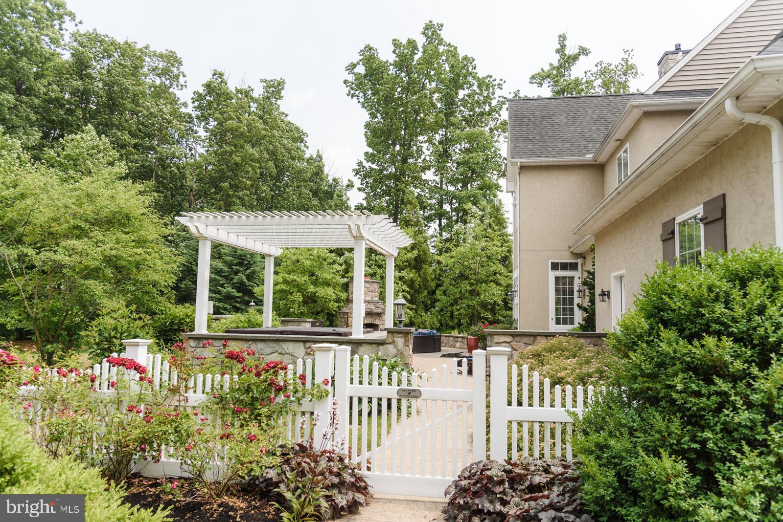 521 Meetinghouse Road Gap, PA 17527 - Photo 78 of 81 Charming garden entrance with lush greenery.