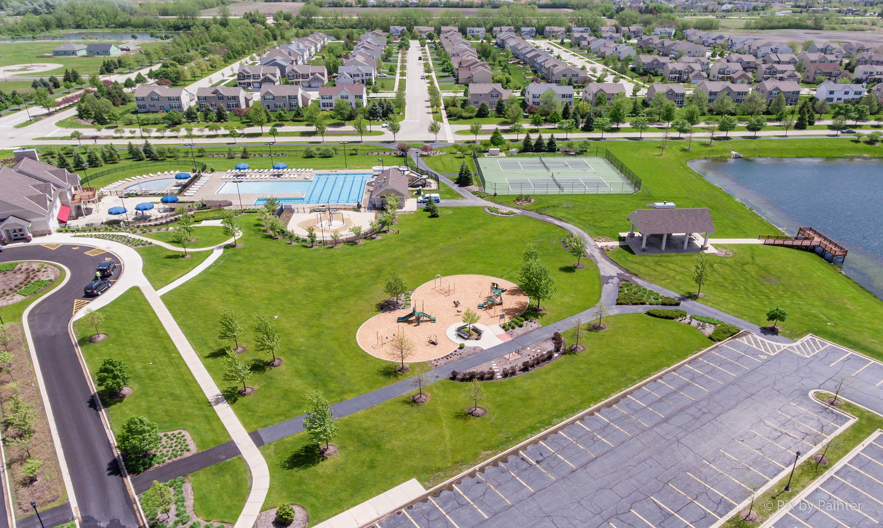 10232 McMahon Way Huntley, IL 60142 - Photo 39 of 46 an aerial view of a play ground and trees in the background