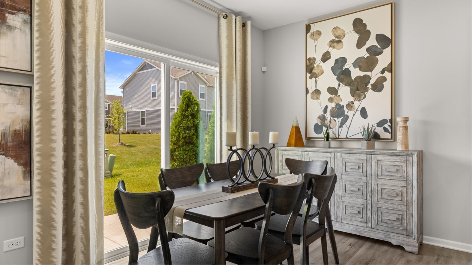 10232 McMahon Way Huntley, IL 60142 - Photo 7 of 46 a view of a dining room with furniture and wooden floor