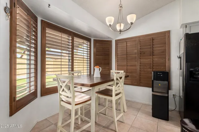 a dining room with furniture and window