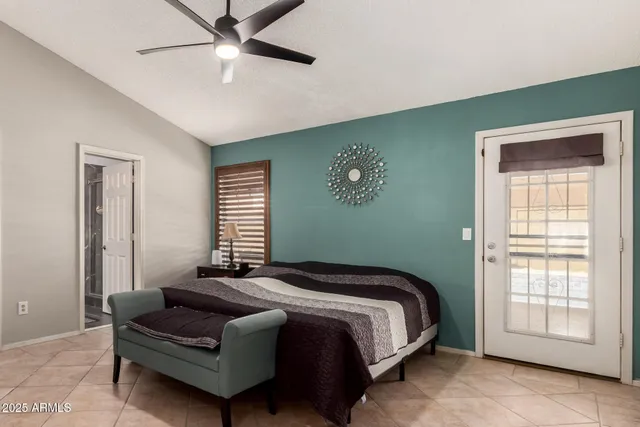 a bedroom with bed and window