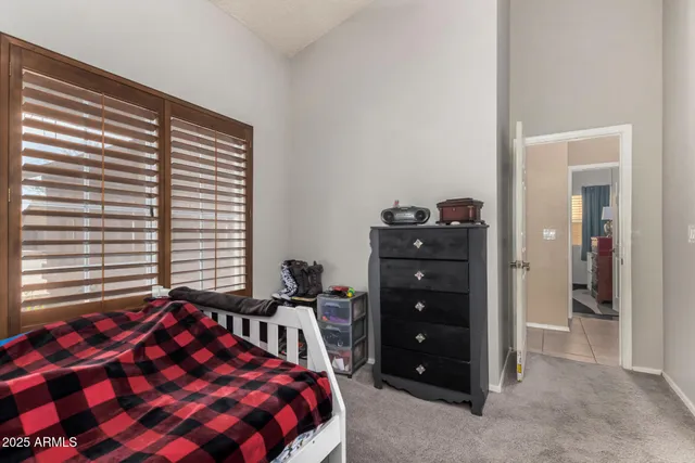 a bedroom with a bed and a closet