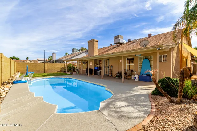 a view of a house with swimming pool