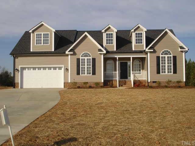 3091 Rock Spring Church Road Creedmoor, NC 27522 - Photo 1 of 1 a front view of a house with a yard and garage