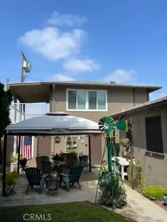 a view of house with outdoor seating space