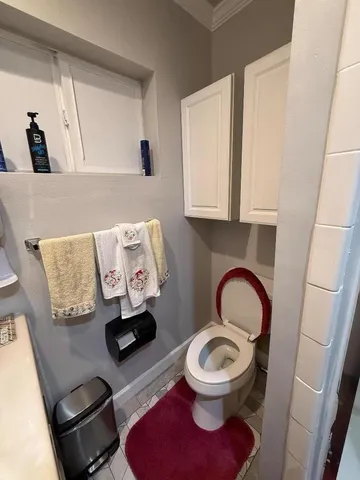 a bathroom with a toilet and a sink