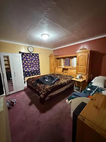 a living room with furniture rug and window
