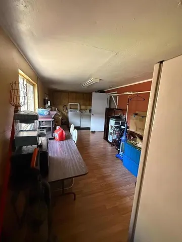 a room with furniture and a flat screen tv