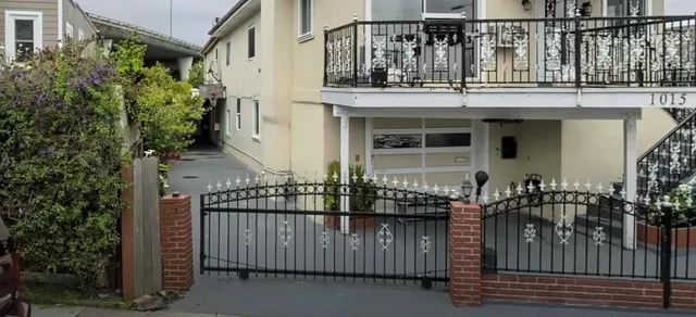 a view of house with outdoor seating area
