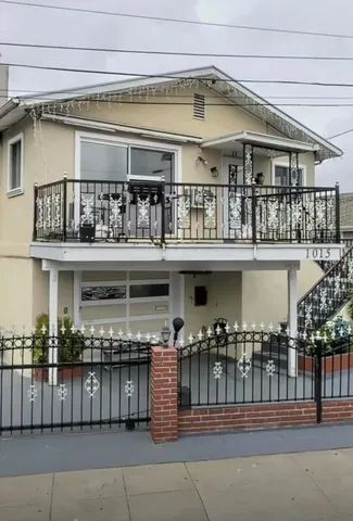 a front view of a building with glass windows and a table