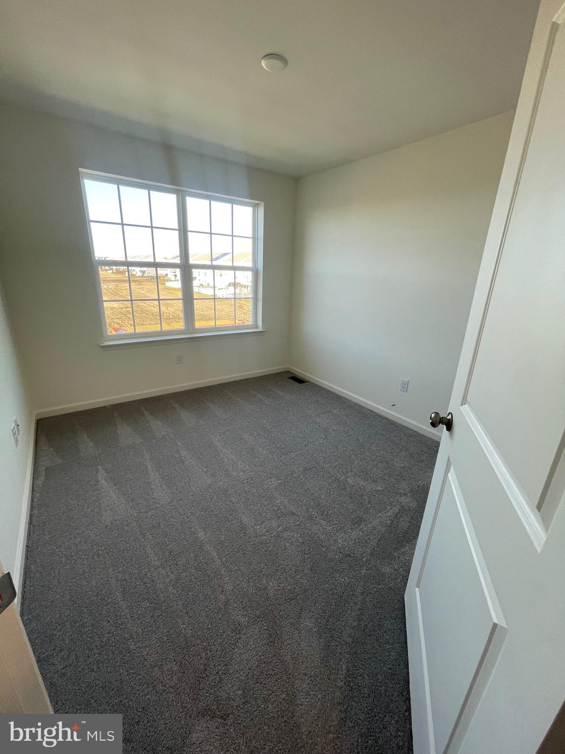 444 Rederick Lane Middletown, DE 19709 - Photo 14 of 16 an empty room with windows