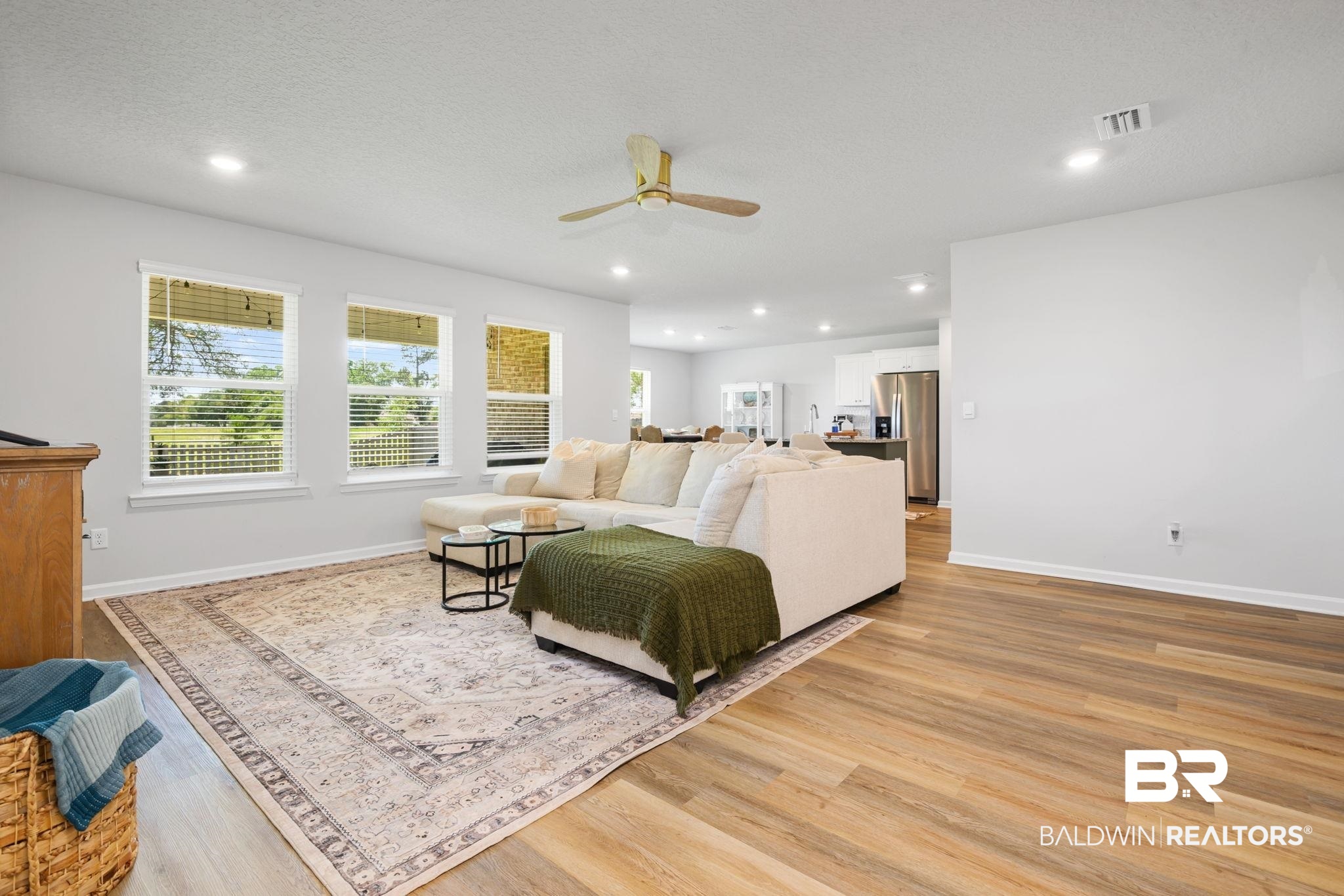 8021 Valor Rdg Way North Mobile, AL 36619 - Photo 22 of 34 Spacious living area featuring wood-finish flooring, recessed lighting, and a ceiling fan