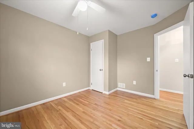 a view of room with wooden floor