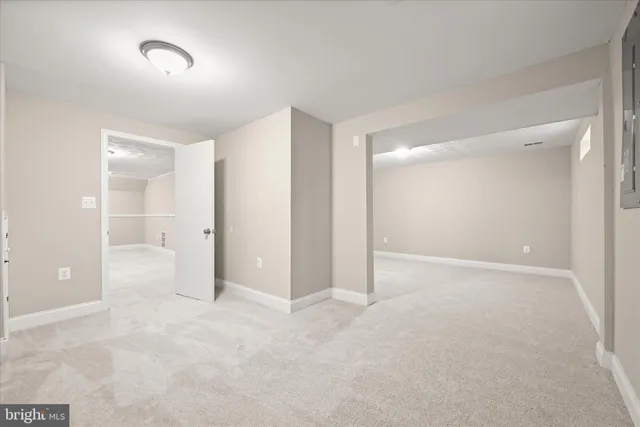 a view of an empty room and a window