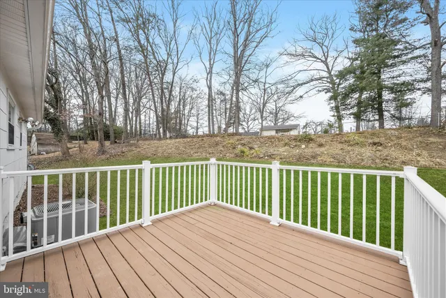 a front view of house with yard patio and green space