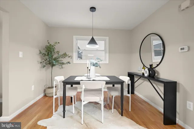 a view of a dining room with furniture and a chandelier