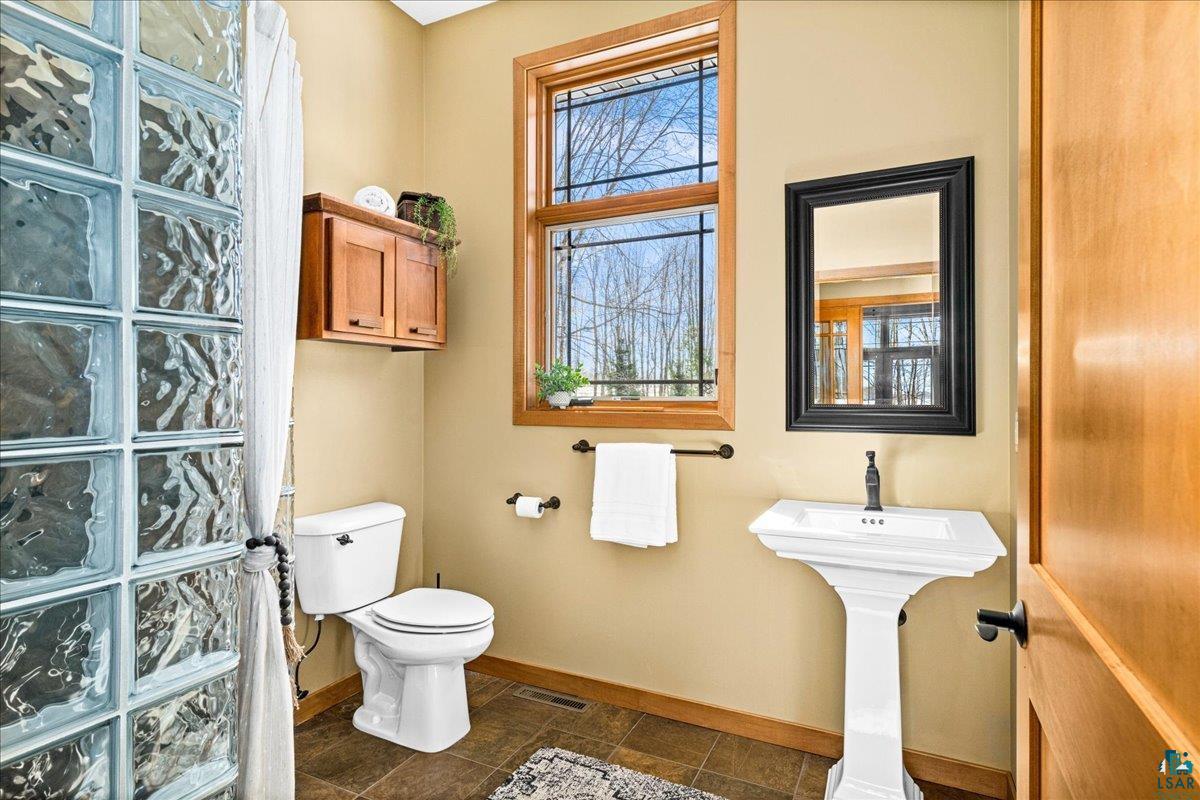 92598 Spells Road Sturgeon Lake, MN 55783 - Photo 21 of 60 Bathroom featuring toilet and baseboards