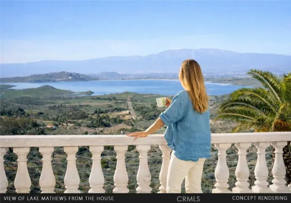 a view of a balcony with wooden floor and a fence
