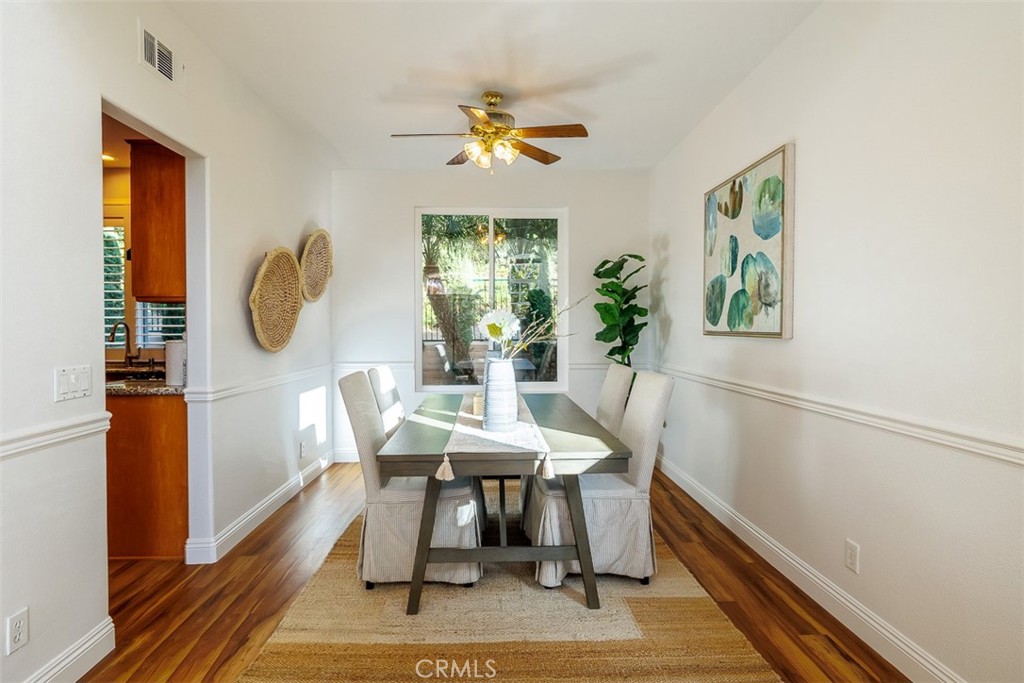 41 Castletree Rancho Santa Margarita, CA 92688 - Photo 12 of 68 a view of a dining room with furniture window and wooden floor