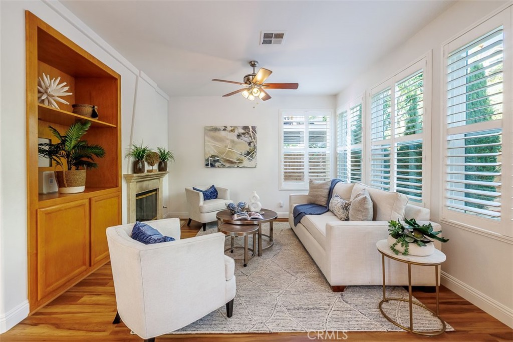 41 Castletree Rancho Santa Margarita, CA 92688 - Photo 16 of 68 a living room with furniture and floor to ceiling windows