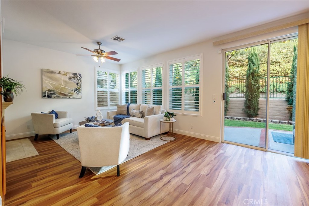 41 Castletree Rancho Santa Margarita, CA 92688 - Photo 18 of 68 a living room with furniture large window and wooden floor