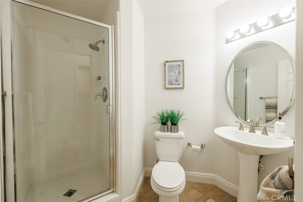 41 Castletree Rancho Santa Margarita, CA 92688 - Photo 26 of 68 a bathroom with a toilet a sink and a mirror