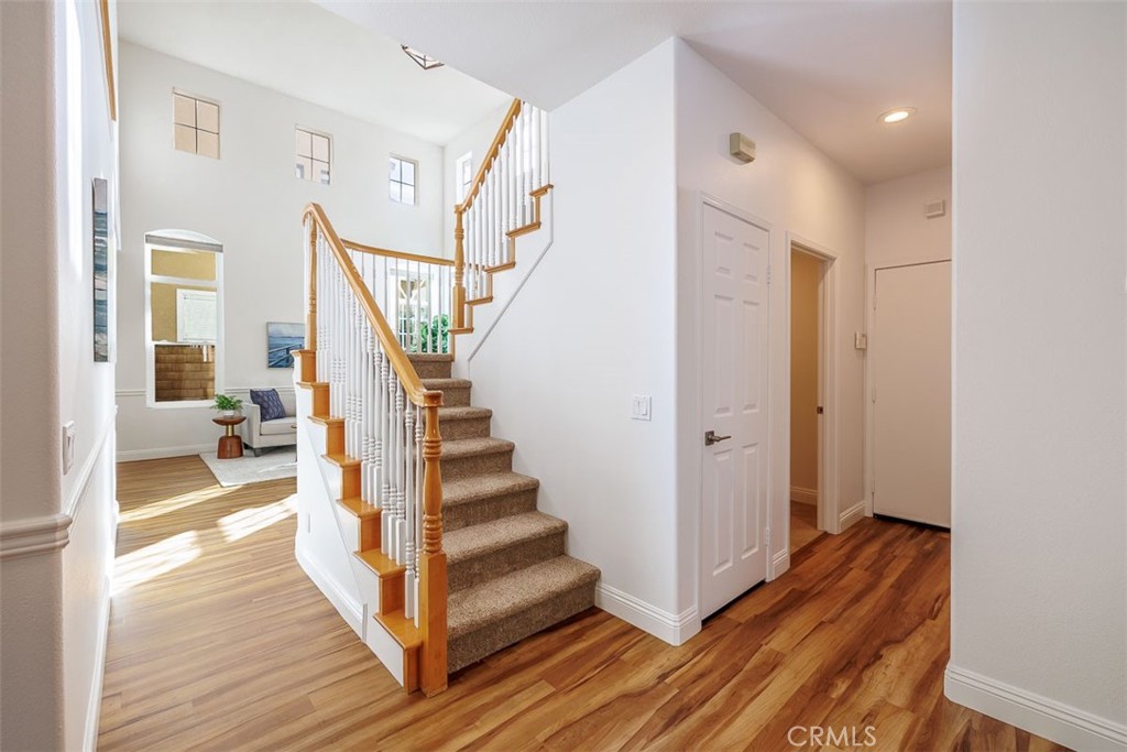 41 Castletree Rancho Santa Margarita, CA 92688 - Photo 29 of 68 a view of a hallway with wooden floor and staircase