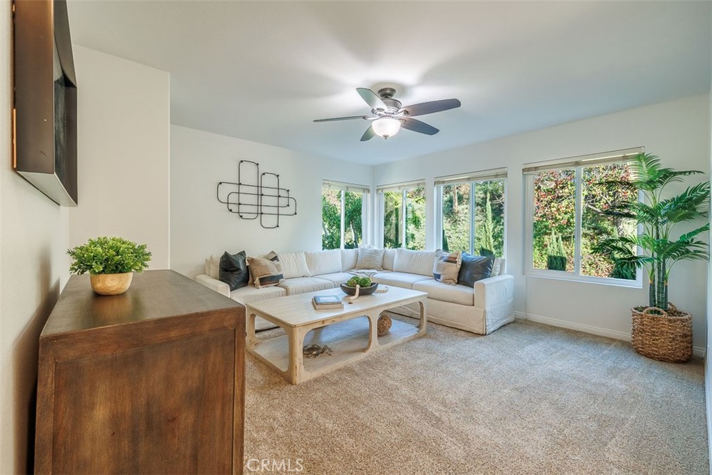 41 Castletree Rancho Santa Margarita, CA 92688 - Photo 32 of 68 a living room with furniture and a potted plant