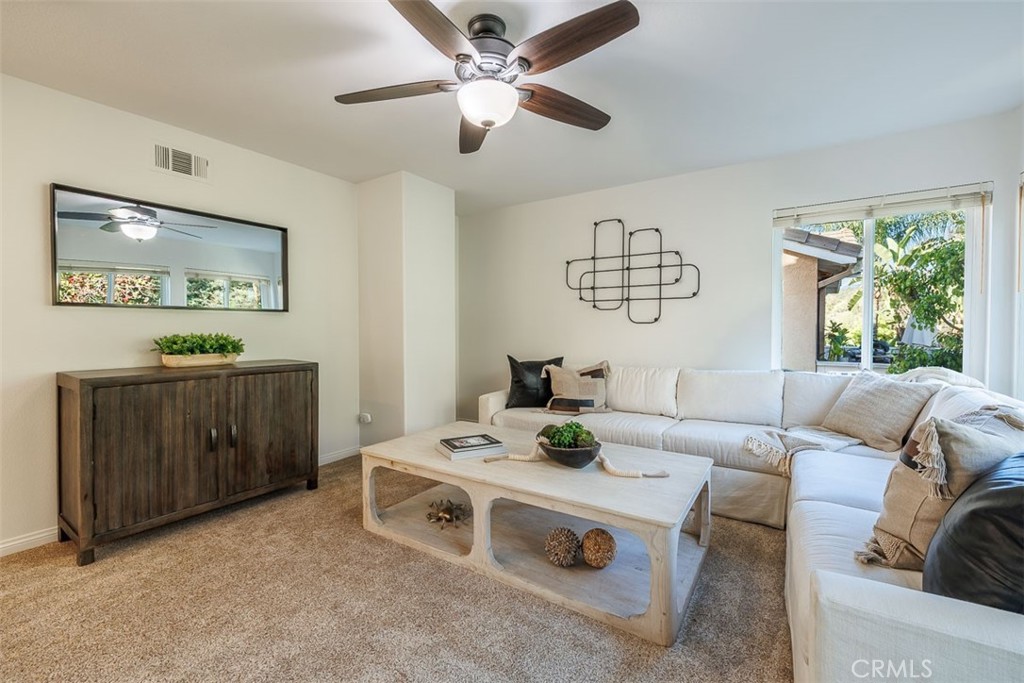 41 Castletree Rancho Santa Margarita, CA 92688 - Photo 34 of 68 a living room with furniture and a table