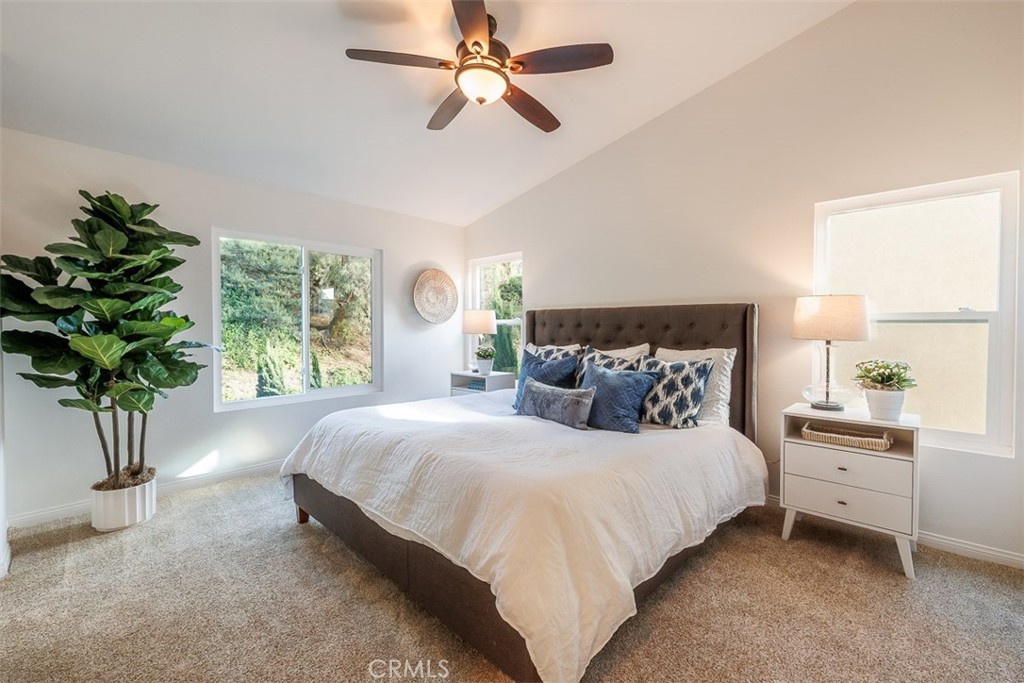 41 Castletree Rancho Santa Margarita, CA 92688 - Photo 36 of 68 a bedroom with bed and a potted plant