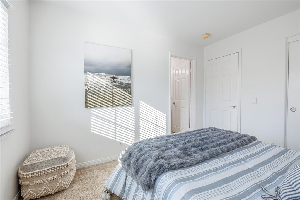 41 Castletree Rancho Santa Margarita, CA 92688 - Photo 45 of 68 a bedroom with a bed and wooden floor