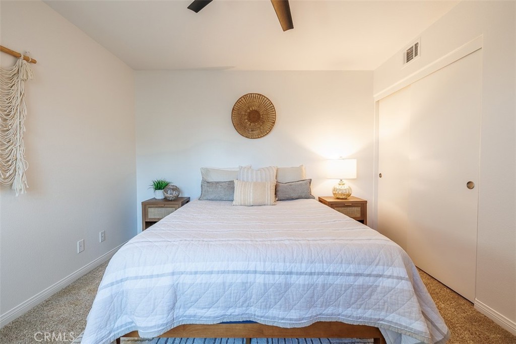 41 Castletree Rancho Santa Margarita, CA 92688 - Photo 47 of 68 a bedroom with a bed and a lamp